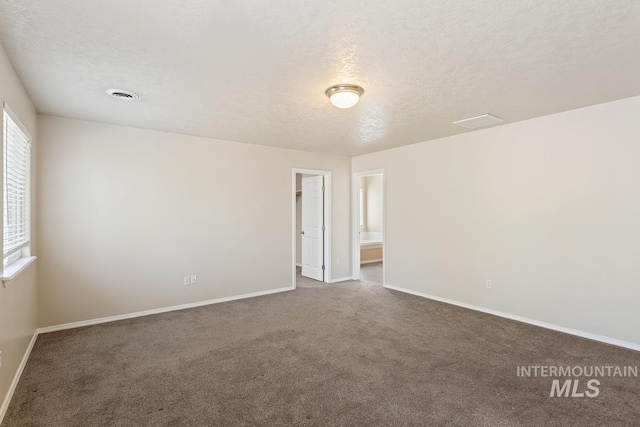 7362 S Shadowmoss Ave, Boise, ID 83709 - spare room featuring a textured ceiling, carpet, and baseboards