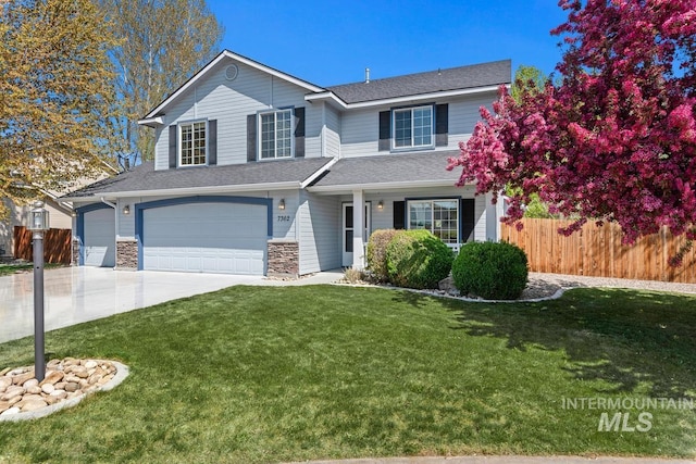 7362 S Shadowmoss Ave, Boise, ID 83709 - view of front of house with an attached garage, driveway, and roof with shingles