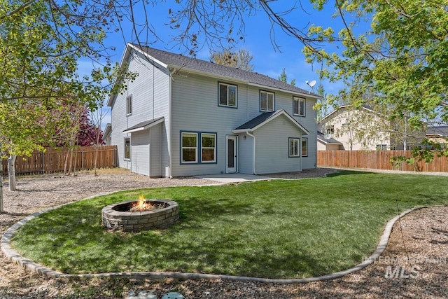 7362 S Shadowmoss Ave, Boise, ID 83709 - back of house with an outdoor fire pit and a patio