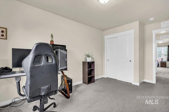 office space featuring carpet flooring and baseboards