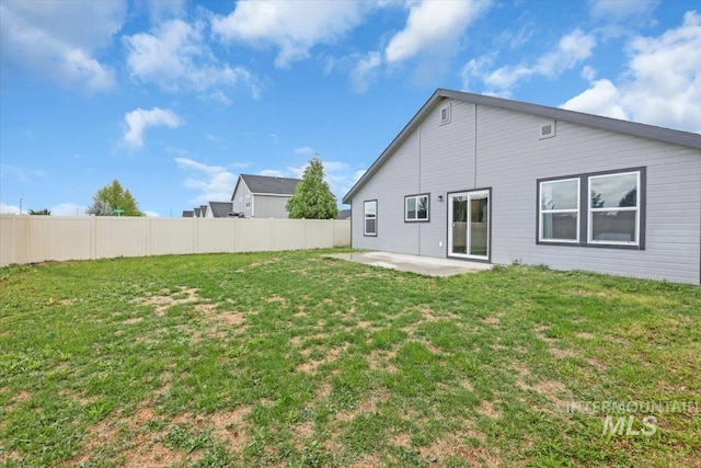 rear view of property featuring a patio area