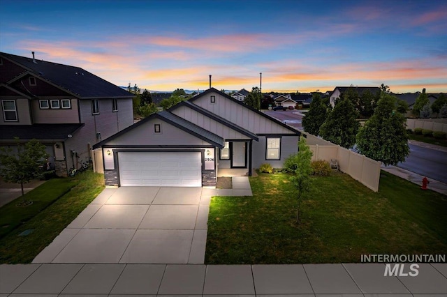 view of front of house featuring a garage, driveway, board and batten siding, stone siding, and a residential view