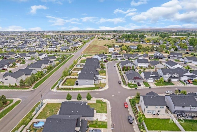 aerial view of property and surrounding area with nearby suburban area
