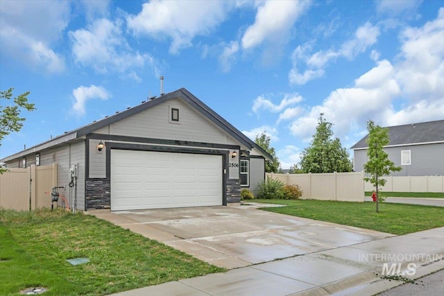 view of front of home with driveway, stone siding, and an attached garage