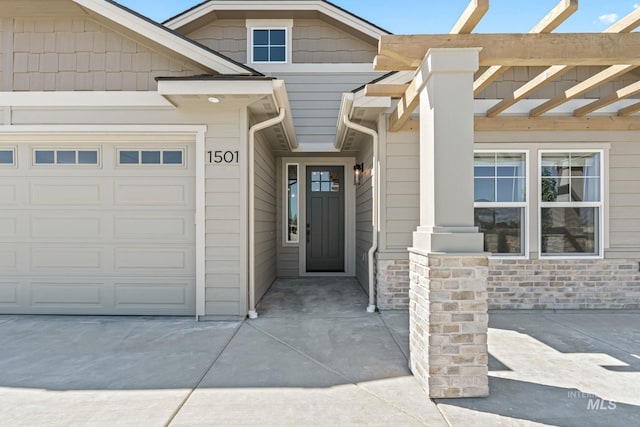 1501 E Andes Dr, Kuna, ID 83634 - entrance to property featuring a pergola and an attached garage