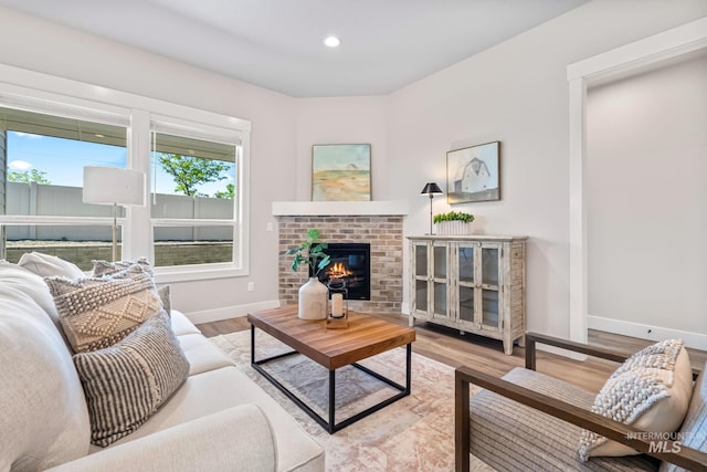 1501 E Andes Dr, Kuna, ID 83634 - living area featuring a fireplace, wood finished floors, and recessed lighting