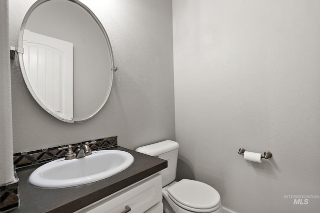 half bath with vanity and toilet