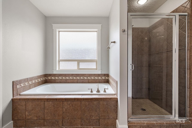 full bath with a shower stall and a garden tub