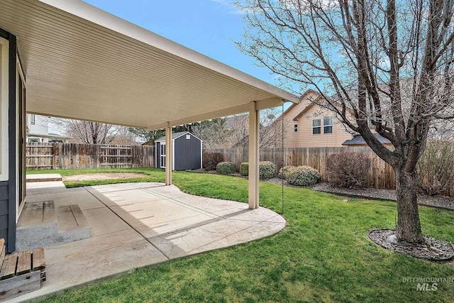 view of patio featuring an outbuilding, a storage shed, and a fenced backyard