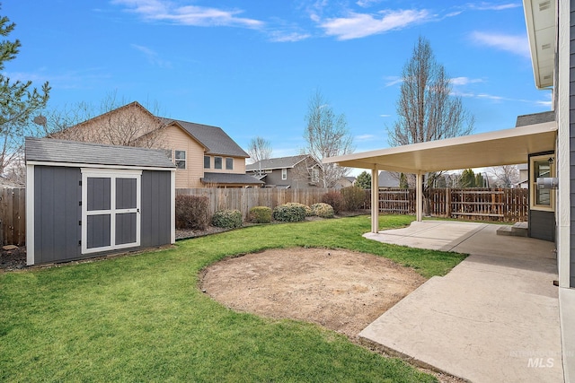 view of yard featuring a fenced backyard, an outdoor structure, a storage shed, and a patio