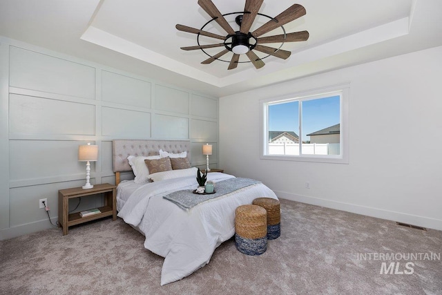 958 Gregory Way, Twin Falls, ID 83301 - bedroom with a raised ceiling, light colored carpet, baseboards, and a ceiling fan