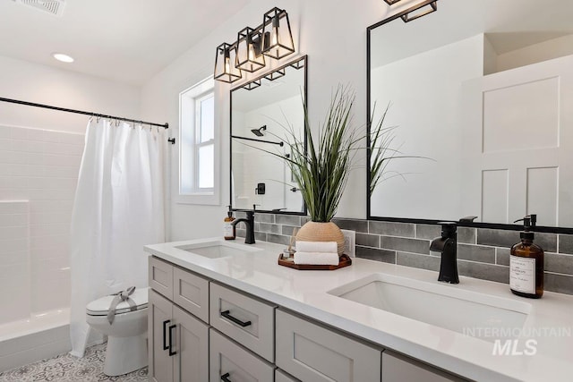 958 Gregory Way, Twin Falls, ID 83301 - full bath featuring double vanity, toilet, and shower / bath combo with shower curtain
