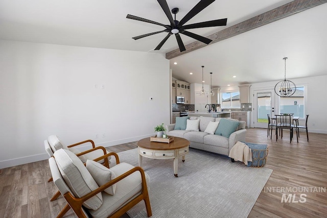 958 Gregory Way, Twin Falls, ID 83301 - living room with ceiling fan, a chandelier, baseboards, light wood-type flooring, and recessed lighting