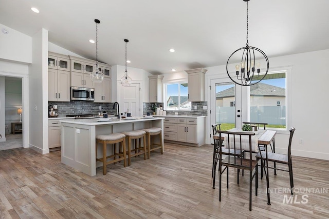 958 Gregory Way, Twin Falls, ID 83301 - dining room featuring a chandelier, light wood-type flooring, vaulted ceiling, baseboards, and recessed lighting