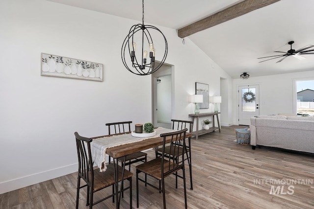 958 Gregory Way, Twin Falls, ID 83301 - dining room featuring a chandelier, beam ceiling, light wood-type flooring, a ceiling fan, and baseboards