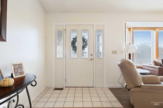 entryway featuring light tile patterned floors