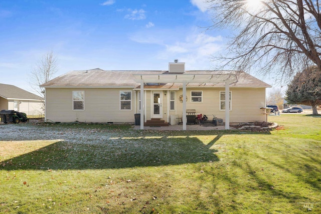 back of property with a pergola and a yard