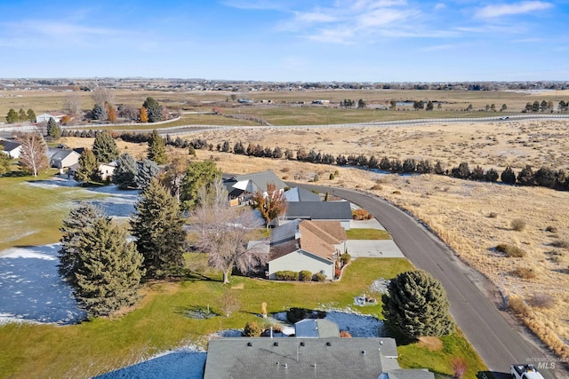 drone / aerial view featuring a rural view and a water view