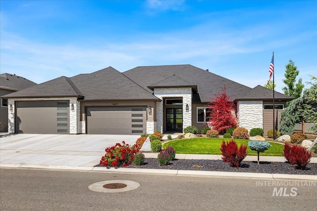 1427 N Morehouse, Eagle, ID 83616 - view of front of home with stone siding, a garage, a front yard, and concrete driveway