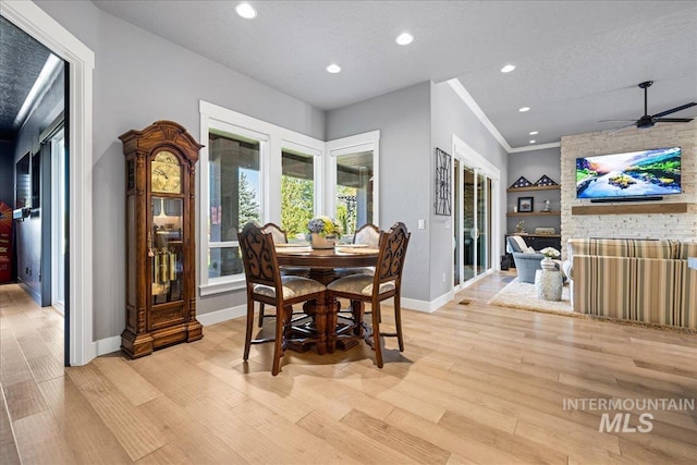 1427 N Morehouse, Eagle, ID 83616 - dining space featuring baseboards, light wood-style floors, recessed lighting, ceiling fan, and a stone fireplace