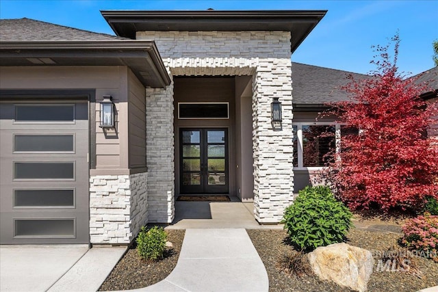 1427 N Morehouse, Eagle, ID 83616 - property entrance featuring stone siding, french doors, and a garage