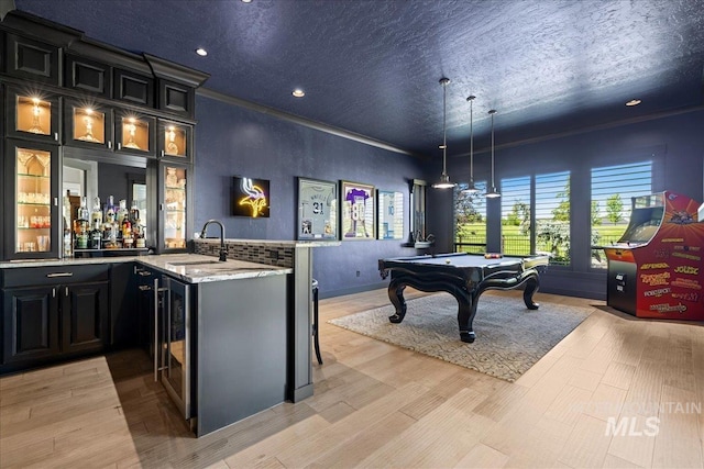 1427 N Morehouse, Eagle, ID 83616 - indoor wet bar featuring billiards, decorative light fixtures, a textured ceiling, recessed lighting, and light wood-style floors