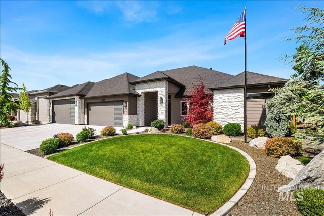 1427 N Morehouse, Eagle, ID 83616 - prairie-style house featuring stone siding, an attached garage, a front lawn, and concrete driveway