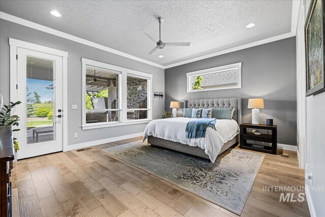1427 N Morehouse, Eagle, ID 83616 - bedroom featuring access to outside, crown molding, a textured ceiling, wood finished floors, and baseboards