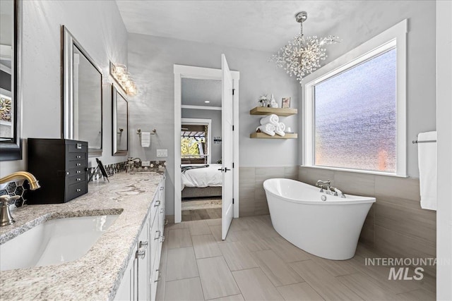 1427 N Morehouse, Eagle, ID 83616 - full bath with double vanity, plenty of natural light, a soaking tub, tile walls, and connected bathroom