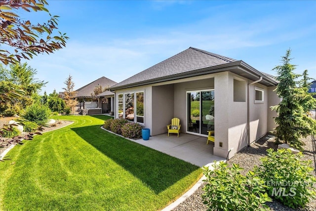 1427 N Morehouse, Eagle, ID 83616 - rear view of property featuring stucco siding, a lawn, and a patio