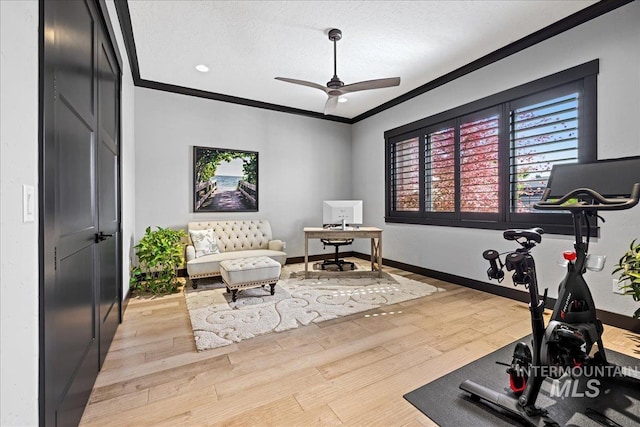 1427 N Morehouse, Eagle, ID 83616 - workout area with crown molding, ceiling fan, wood finished floors, and baseboards