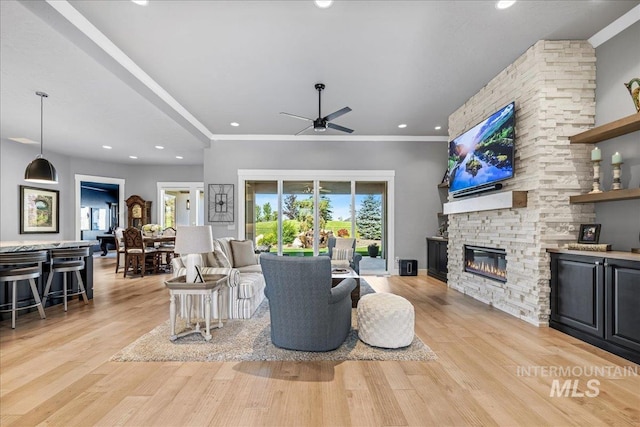 1427 N Morehouse, Eagle, ID 83616 - living area featuring a ceiling fan, light wood finished floors, a fireplace, recessed lighting, and ornamental molding