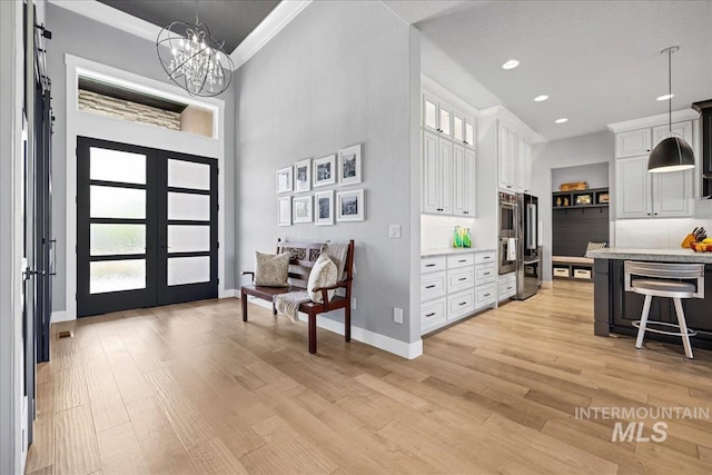 1427 N Morehouse, Eagle, ID 83616 - foyer featuring a chandelier, light wood finished floors, baseboards, crown molding, and recessed lighting