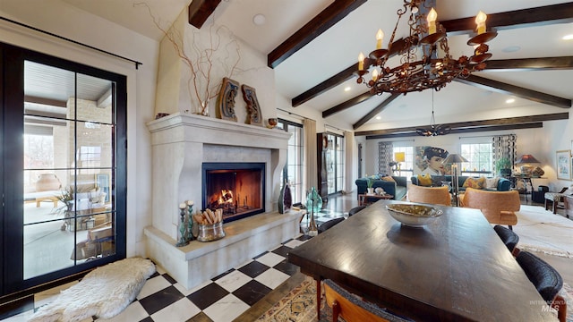 dining room with recessed lighting, lofted ceiling with beams, a chandelier, tile patterned floors, and a high end fireplace