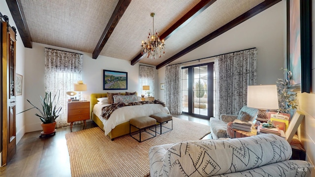bedroom featuring vaulted ceiling with beams, access to exterior, wood finished floors, and a chandelier