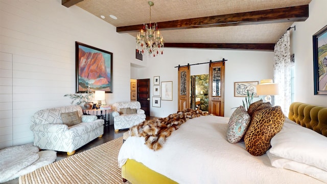 bedroom with a barn door, vaulted ceiling with beams, wood finished floors, and a chandelier