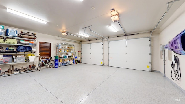 garage featuring a garage door opener