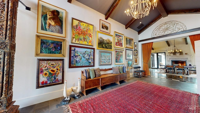 living area with high vaulted ceiling, a lit fireplace, baseboards, beamed ceiling, and a notable chandelier