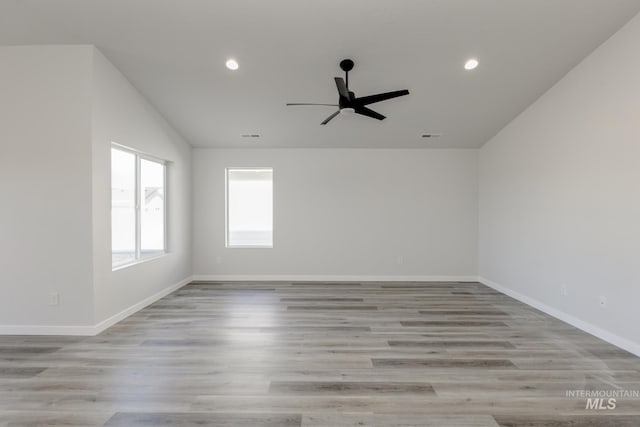 unfurnished room featuring baseboards, recessed lighting, lofted ceiling, and ceiling fan