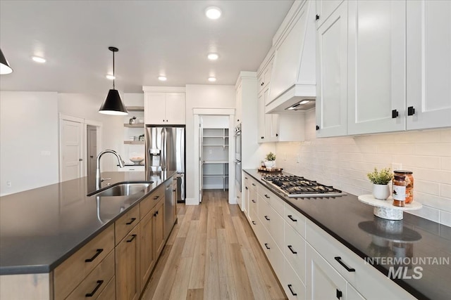 499 S Short Ln, Eagle, ID 83616 - kitchen featuring stainless steel appliances, dark countertops, open shelves, light wood-type flooring, and recessed lighting