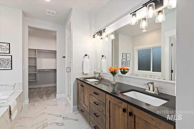 499 S Short Ln, Eagle, ID 83616 - full bathroom with double vanity, marble finish flooring, a bath, and a spacious closet