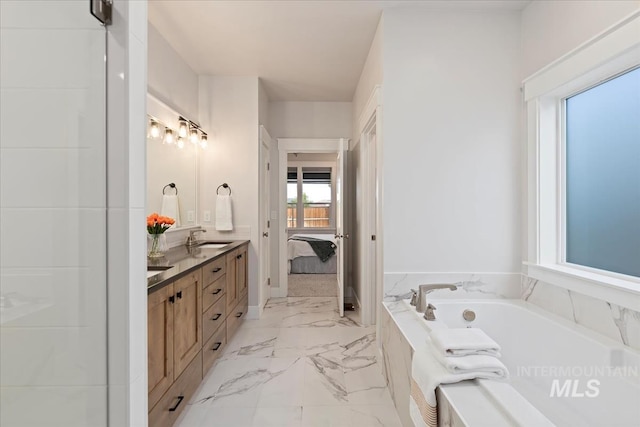499 S Short Ln, Eagle, ID 83616 - bathroom featuring double vanity, connected bathroom, a bath, and marble finish flooring