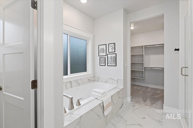 499 S Short Ln, Eagle, ID 83616 - bathroom featuring a bath, a spacious closet, marble finish floors, and a shower stall