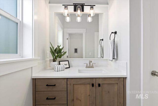 499 S Short Ln, Eagle, ID 83616 - bathroom featuring vanity and a chandelier
