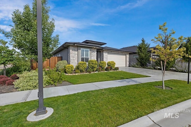 499 S Short Ln, Eagle, ID 83616 - view of front of home featuring stone siding, a garage, and driveway