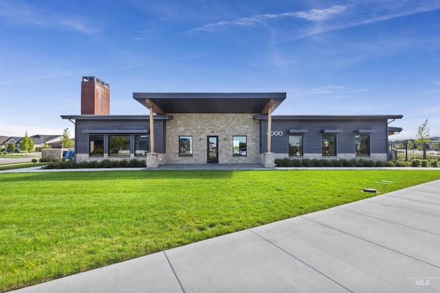 499 S Short Ln, Eagle, ID 83616 - rear view of property featuring stone siding, a chimney, and a yard