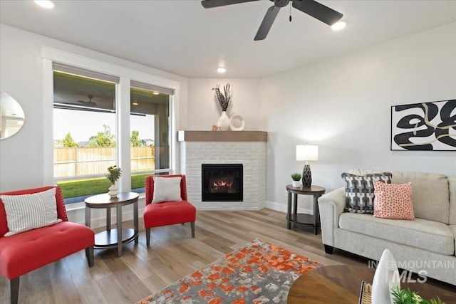 499 S Short Ln, Eagle, ID 83616 - living room with a fireplace, wood finished floors, ceiling fan, and recessed lighting