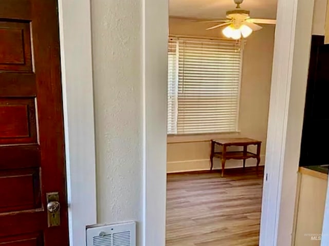 bathroom featuring hardwood / wood-style flooring and ceiling fan