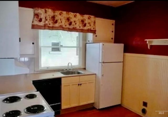 kitchen featuring sink and white appliances