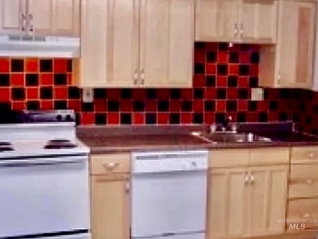 kitchen featuring white appliances, decorative backsplash, exhaust hood, and sink